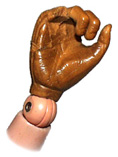 Tom's hand, fingers snipped
